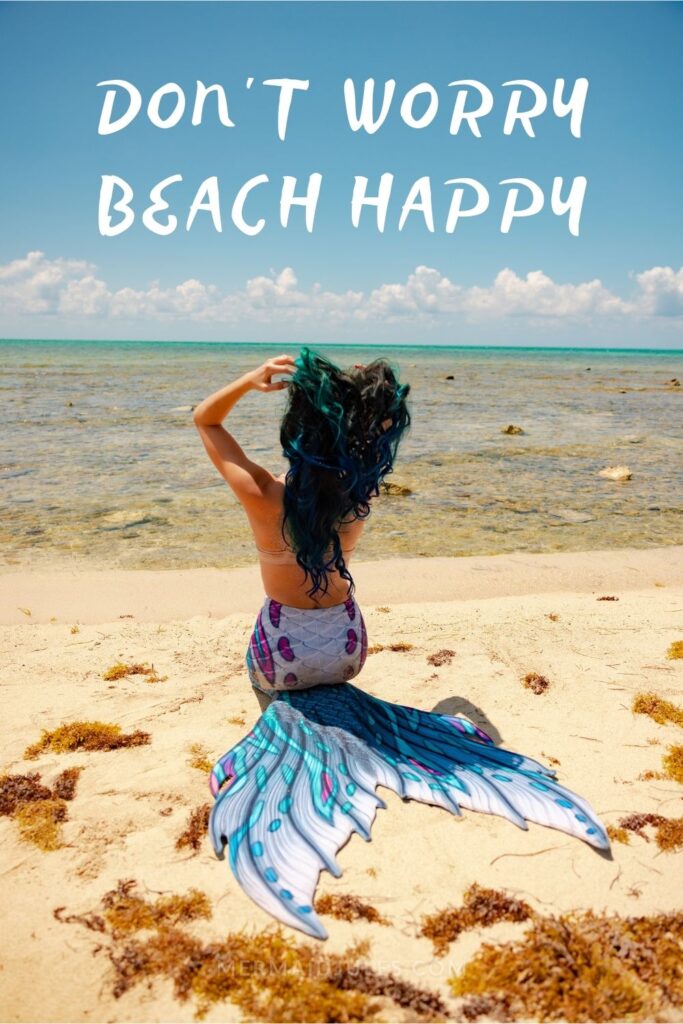 "Don't worry, beach happy" Below beach quote: A carefree mermaid looks out to sea