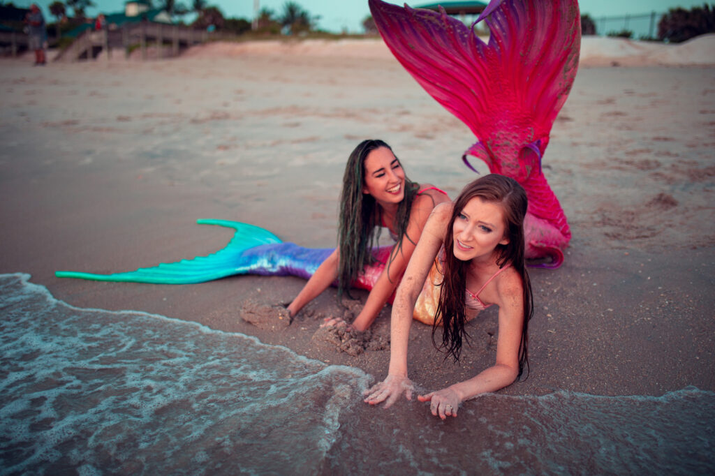 Mermaid Jules pounces on her mermaid friend at the beach!