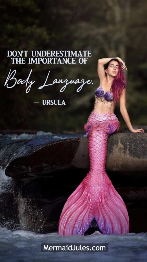 "Don't underestimate the importance of body language" - Ursula The Little Mermaid Quote framing Jules the pink mermaid as she models on a waterfall.