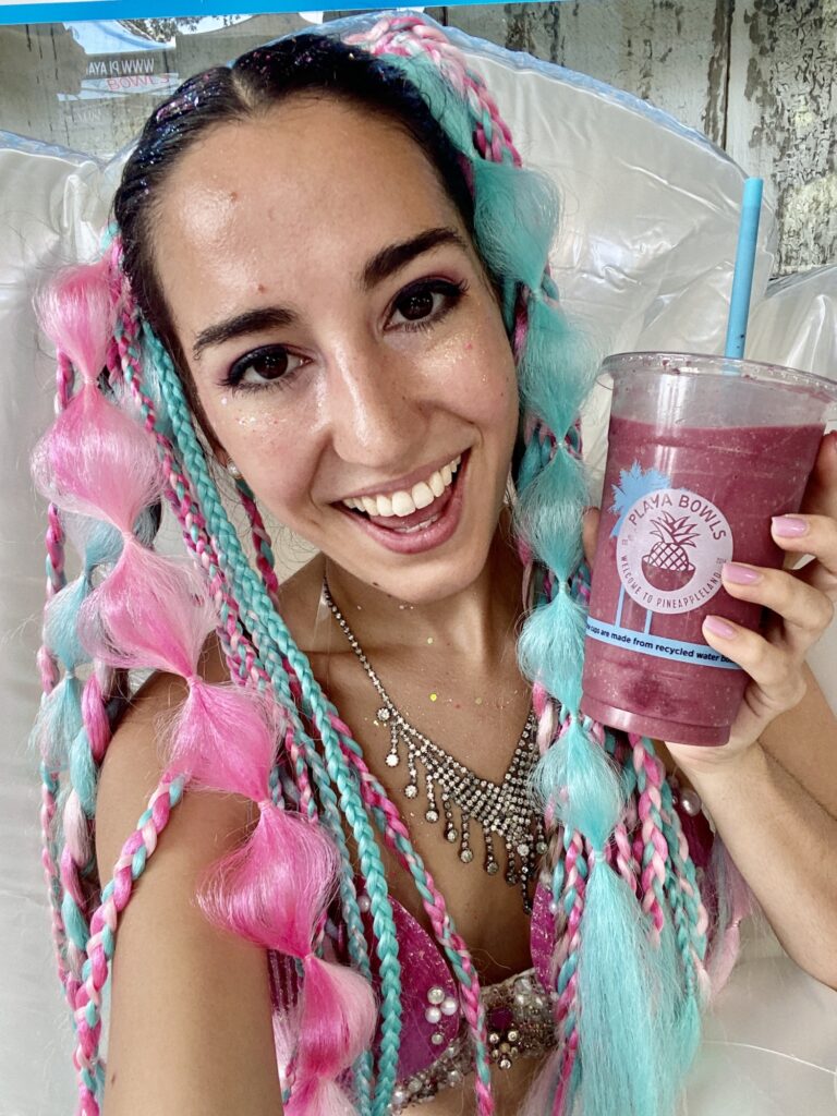 Mermaid Jules smiles and sips an Acai Soothie at Playa Bowls Davie Grand Opening event.