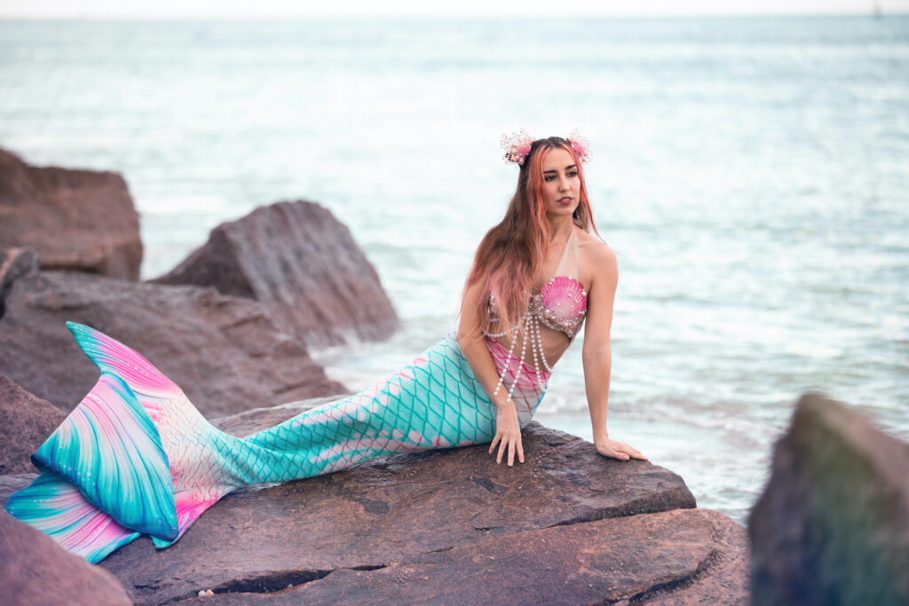 Fort Pierce inlet mermaid sighting - Mermaid Jules on the rocky shore