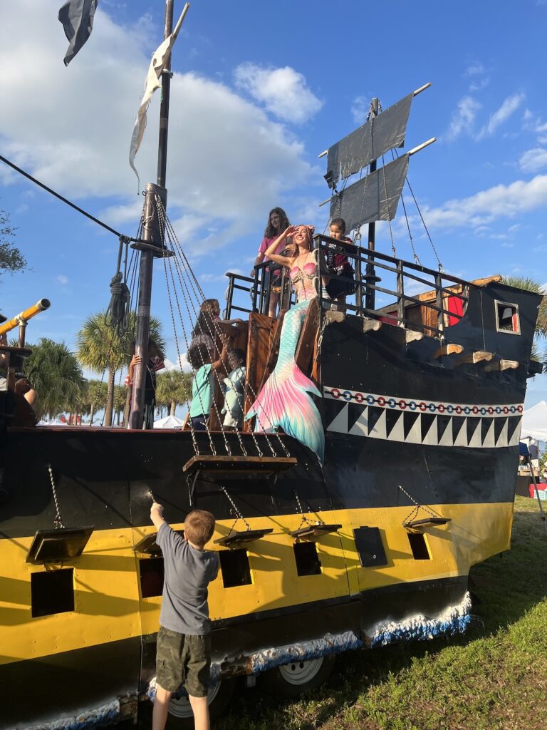 mermaid jules on a pirate ship playground at the treasure coast pirate fest
