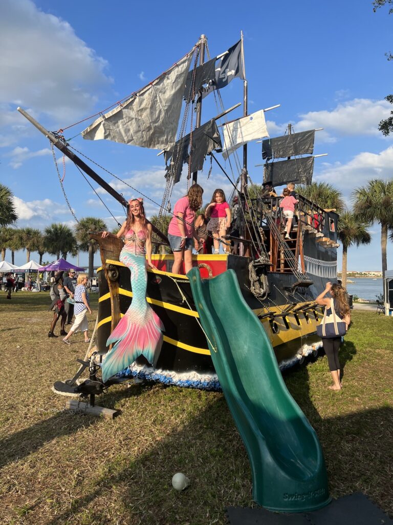 mermaid jules on a pirate ship playground at the treasure coast pirate festival