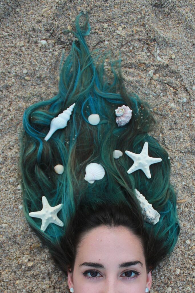Blue mermaid hair aesthetic with seashells and starfish