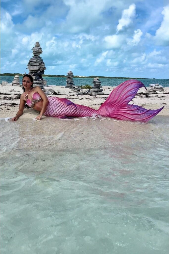 Things to do Bahamas: Pink Mermaid relaxes on a Bahamas Sandbar.