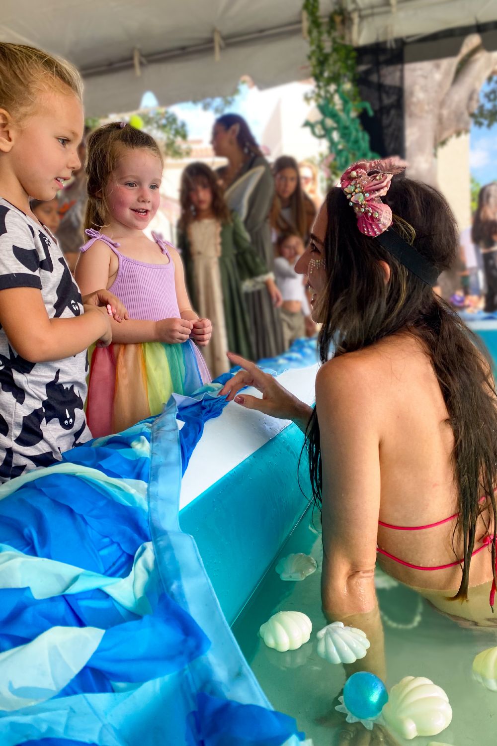 Mermaid Jules meets kids from the mermaid pool at Boynton Beach Pirate Festival 2023